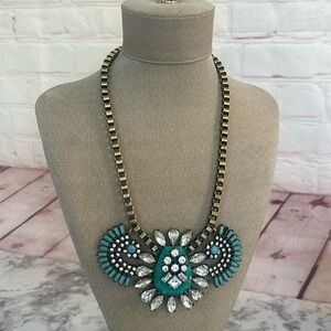 Statement blue embellished necklace blue and brass like material